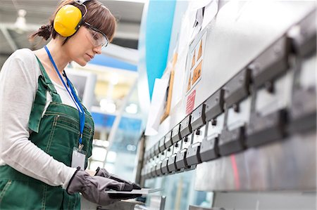 safety in plant - Female worker working in factory Stock Photo - Premium Royalty-Free, Code: 6113-08393873