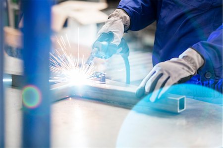 people manufacturing factory - Welder welding steel in factory Stock Photo - Premium Royalty-Free, Code: 6113-08393837