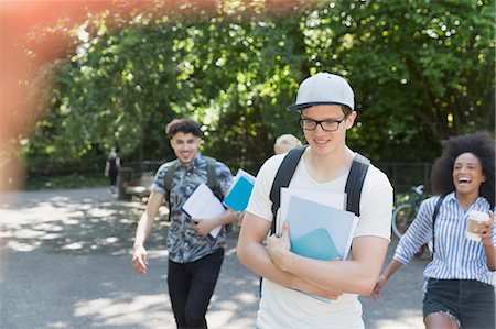 College students walking in park Stock Photo - Premium Royalty-Free, Code: 6113-08321188