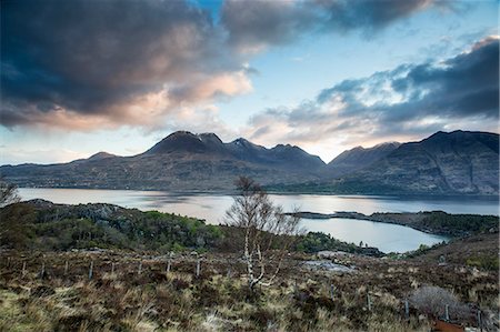 simsearch:6113-08321260,k - Scenic view clouds over calm mountains and lake, Russel Burn, Applecross, Scotland Photographie de stock - Premium Libres de Droits, Code: 6113-08321268