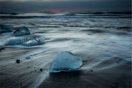 stormy beach - Ice on stormy cold ocean beach, Iceland Stock Photo - Premium Royalty-Free, Code: 6113-08321225