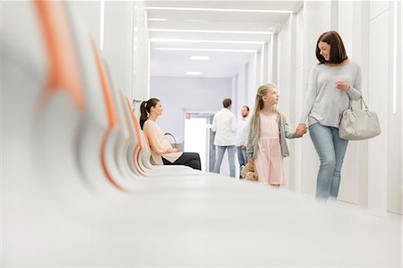 patient clinic - Mother and daughter holding hands walking in hospital corridor Stock Photo - Premium Royalty-Free, Code: 6113-08321336