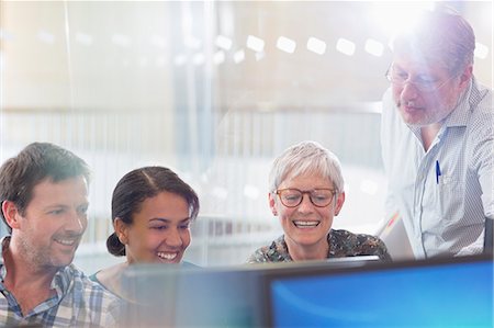 student and professor - Students working at computer in adult education classroom Stock Photo - Premium Royalty-Free, Code: 6113-08321454