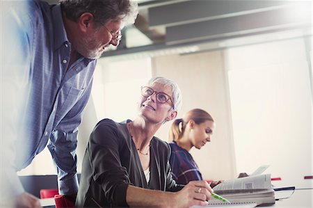 simsearch:6113-08321414,k - Students discussing homework in adult education classroom Stock Photo - Premium Royalty-Free, Code: 6113-08321431