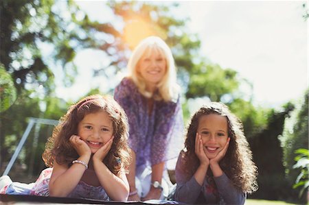 simsearch:649-06489279,k - Portrait smiling grandmother with twin granddaughters in park Stock Photo - Premium Royalty-Free, Code: 6113-08321573