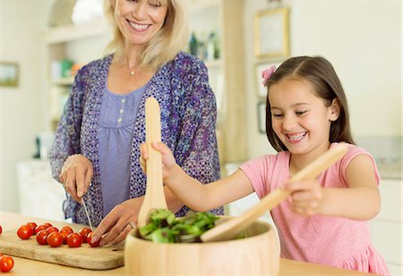 simsearch:6113-08321652,k - Grandmother and granddaughter preparing salad in kitchen Stock Photo - Premium Royalty-Free, Code: 6113-08321635