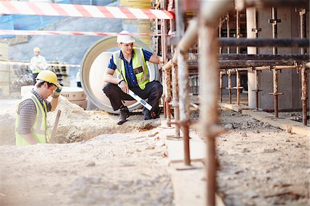 simsearch:6113-08321783,k - Construction workers working at construction site Stock Photo - Premium Royalty-Free, Code: 6113-08321730