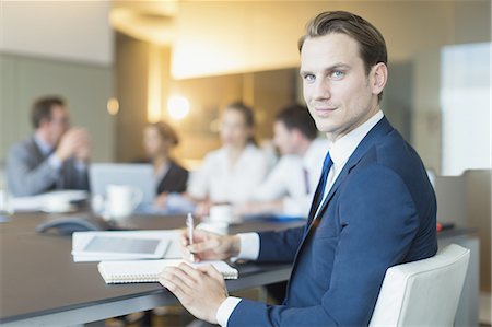 simsearch:6113-07961744,k - Portrait confident businessman in conference room meeting Stock Photo - Premium Royalty-Free, Code: 6113-08549960