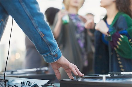 simsearch:628-05817321,k - DJ spinning records at party Stock Photo - Premium Royalty-Free, Code: 6113-08568510