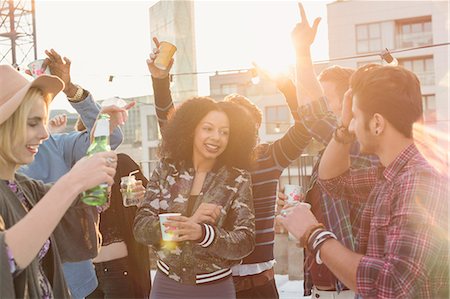 simsearch:6113-08568465,k - Enthusiastic young adult friends dancing and drinking at rooftop party Stock Photo - Premium Royalty-Free, Code: 6113-08568519