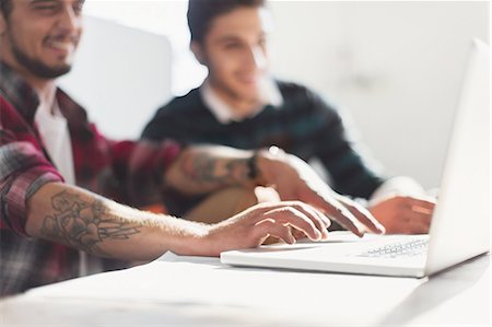 student business man - Creative young businessmen working at laptop Stock Photo - Premium Royalty-Free, Code: 6113-08568532