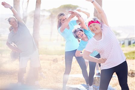 simsearch:6122-07706535,k - Senior adults practicing yoga in sunny park Stock Photo - Premium Royalty-Free, Code: 6113-08568732