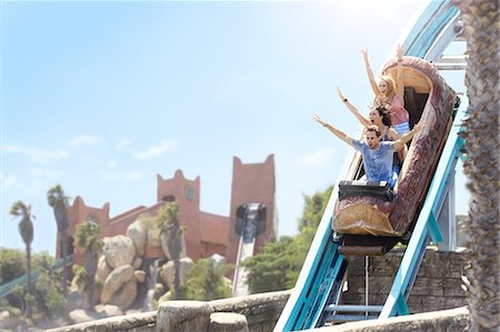 descending - Enthusiastic friends cheering on log amusement park ride Stock Photo - Premium Royalty-Free, Code: 6113-08521363