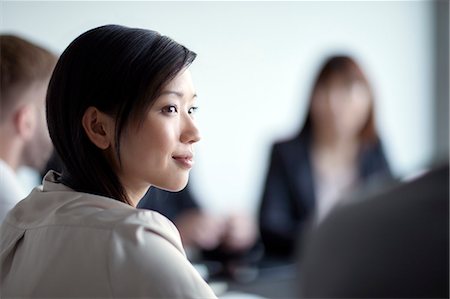 simsearch:6113-08521456,k - Attentive businesswoman listening in meeting Stock Photo - Premium Royalty-Free, Code: 6113-08521442
