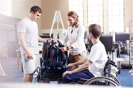 simsearch:6113-08521493,k - Physical therapists with man in wheelchair Stock Photo - Premium Royalty-Free, Code: 6113-08521466