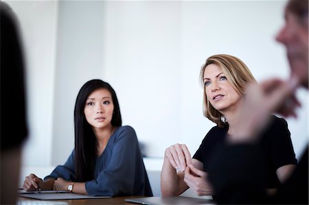 simsearch:6116-09013545,k - Serious businesswomen in meeting Stock Photo - Premium Royalty-Free, Code: 6113-08521422