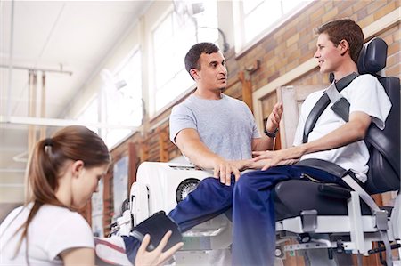encouragement - Physical therapist explaining equipment to man Stock Photo - Premium Royalty-Free, Code: 6113-08521505