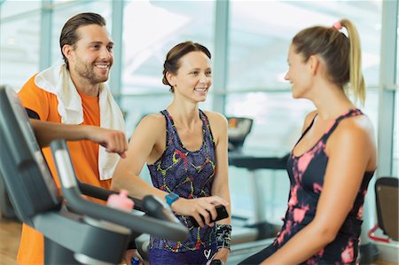 simsearch:6113-08536110,k - Smiling friends talking at gym Stock Photo - Premium Royalty-Free, Code: 6113-08536073