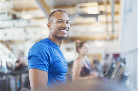 fitness man portrait not woman not group - Portrait smiling man on treadmill at gym Stock Photo - Premium Royalty-Free, Code: 6113-08536032