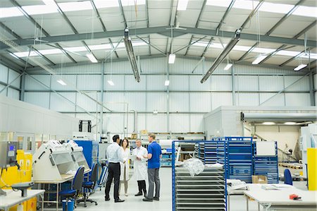 production meeting - Engineer and managers talking in steel factory Stock Photo - Premium Royalty-Free, Code: 6113-08655259