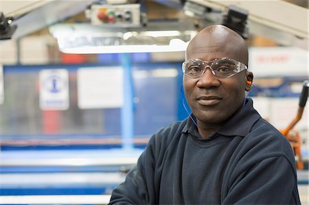 Portrait confident worker in steel factory Stock Photo - Premium Royalty-Free, Code: 6113-08655266