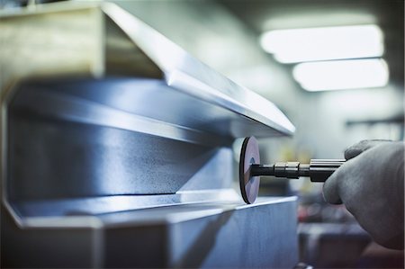 simsearch:6113-08655244,k - Close up worker sanding steel in steel factory Stock Photo - Premium Royalty-Free, Code: 6113-08655231