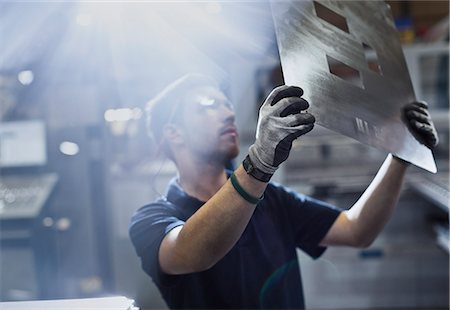 simsearch:6113-08655241,k - Worker examining piece in steel factory Stock Photo - Premium Royalty-Free, Code: 6113-08655235