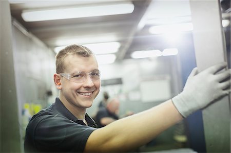 factory happy - Portrait smiling worker in steel factory Stock Photo - Premium Royalty-Free, Code: 6113-08655353