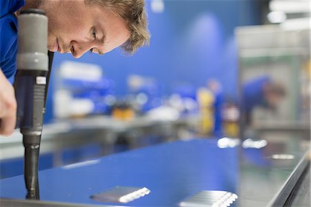 factory and closeup - Worker drilling steel in steel factory Stock Photo - Premium Royalty-Free, Code: 6113-08655350