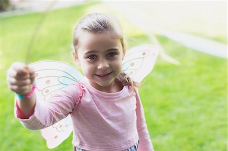simsearch:6122-07700673,k - Portrait smiling girl in fairy wings Stock Photo - Premium Royalty-Free, Code: 6113-08655381