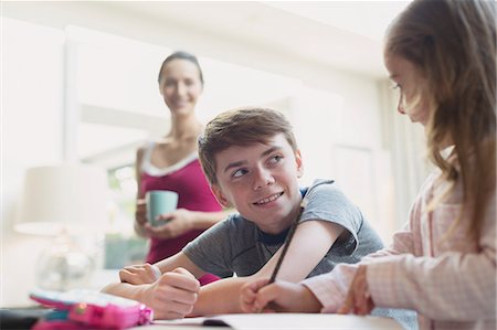 simsearch:6113-08655413,k - Brother and sister doing homework Stock Photo - Premium Royalty-Free, Code: 6113-08655396