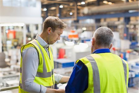 power plant manufacture - Supervisors talking on platform above steel factory Stock Photo - Premium Royalty-Free, Code: 6113-08655320