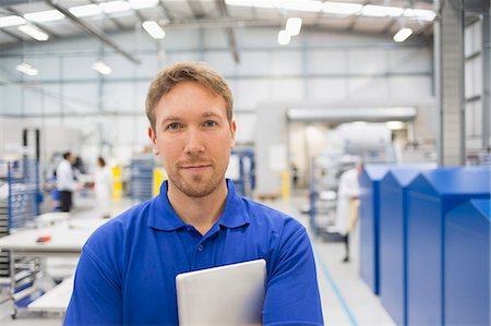 electronics manufacturing - Portrait confident manager with digital tablet in steel factory Stock Photo - Premium Royalty-Free, Code: 6113-08655328