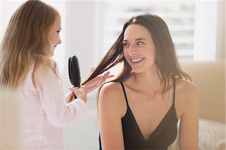 family getting ready - Daughter brushing mother's hair Stock Photo - Premium Royalty-Free, Code: 6113-08655405