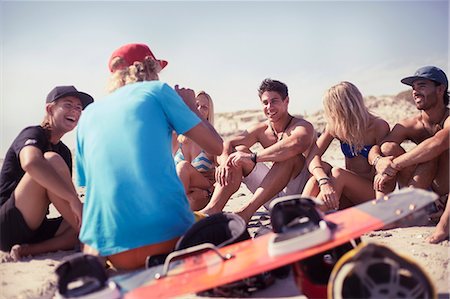 Friends learning kiteboarding on sunny beach Photographie de stock - Premium Libres de Droits, Code: 6113-08655580