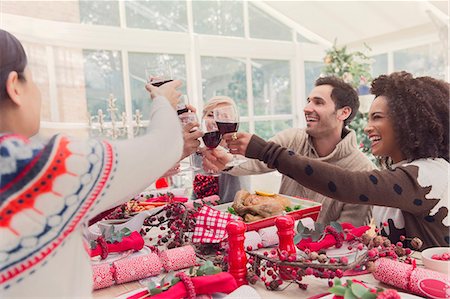 simsearch:6113-08659543,k - Friends toasting wine glasses at Christmas table Stock Photo - Premium Royalty-Free, Code: 6113-08659553