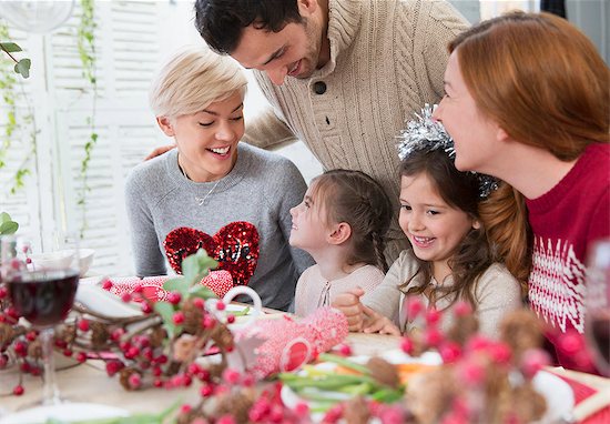 Smiling family at Christmas dinner Stock Photo - Premium Royalty-Free, Image code: 6113-08659569