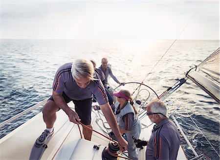 sailing crew - Retired friends sailing on sunny ocean Stock Photo - Premium Royalty-Free, Code: 6113-08698088