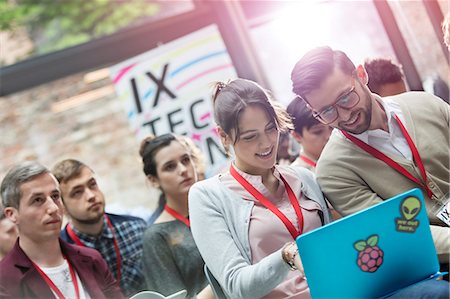 simsearch:6113-08698029,k - Man and woman using laptop at technology conference Foto de stock - Sin royalties Premium, Código: 6113-08698026