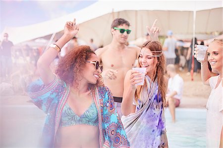 person cupping water - Young women dancing at music festival Stock Photo - Premium Royalty-Free, Code: 6113-08698270
