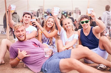 excited, arms up - Portrait young friends with beer hanging out at music festival Stock Photo - Premium Royalty-Free, Code: 6113-08698274