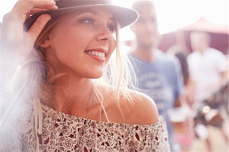simsearch:6113-07564863,k - Close up smiling young blonde woman at music festival Stock Photo - Premium Royalty-Free, Code: 6113-08698276