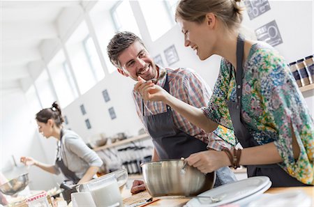 simsearch:6113-08743631,k - Couple enjoying cooking class kitchen Stock Photo - Premium Royalty-Free, Code: 6113-08743638