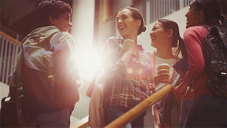 female with backpack - Smiling college students on stairway Stock Photo - Premium Royalty-Free, Code: 6113-08769645