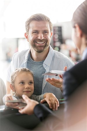 sieben - Father and daughter with airplane tickets at airport check-in counter Stockbilder - Premium RF Lizenzfrei, Bildnummer: 6113-08784183