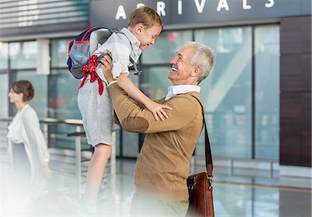 family and vacation and airport - Son greeting father at airport Stock Photo - Premium Royalty-Free, Code: 6113-08784208