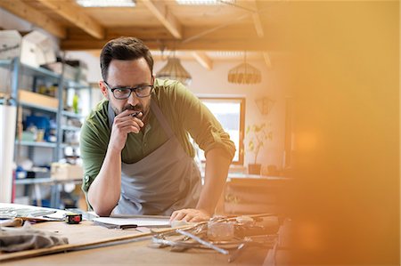 picture of gears - Focused artist working in studio Stock Photo - Premium Royalty-Free, Code: 6113-08784358