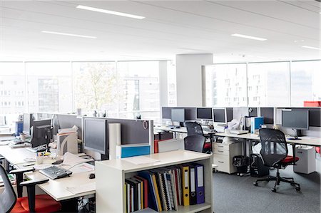 Computers and desks in vacant open plan office Stock Photo - Premium Royalty-Free, Code: 6113-08784475