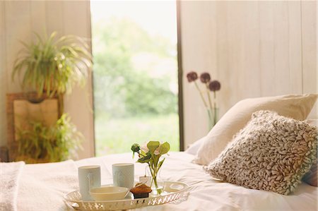 simsearch:6113-08722099,k - Breakfast tray with flower on bed in tranquil bedroom Stock Photo - Premium Royalty-Free, Code: 6113-08722070