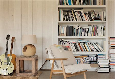 stack chairs - Home showcase guitars and books on bookshelf Stock Photo - Premium Royalty-Free, Code: 6113-08722100